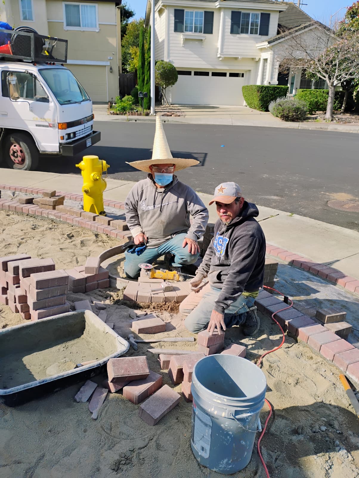 Brick paver walkway installation in progress